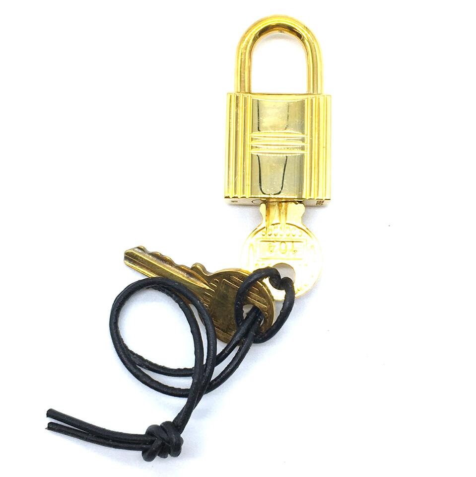 Hermes Gold Cadena Lock Key Set with gold-tone hardware and turn lock  closure at 1stDibs